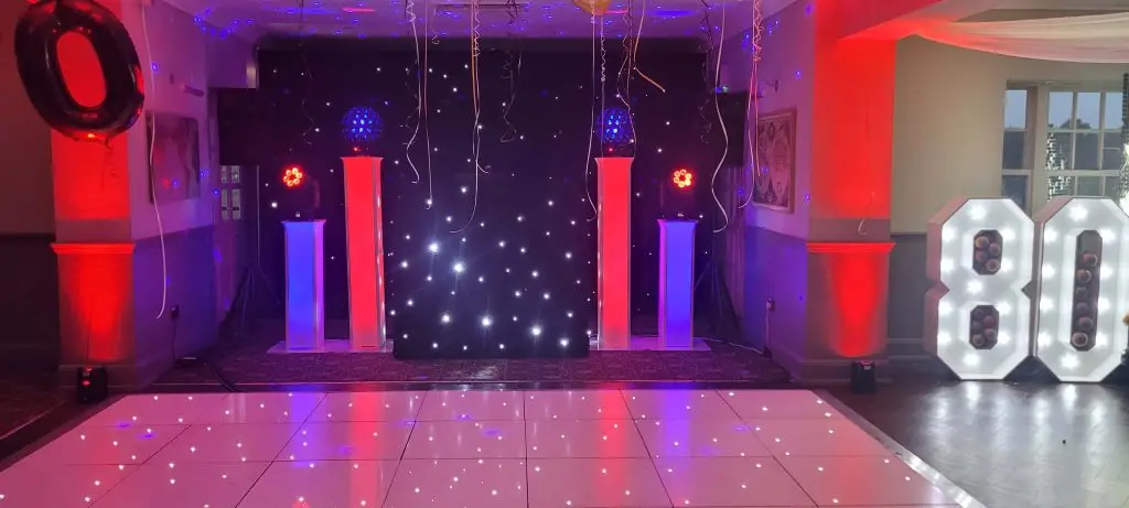 Woolston Manor Chigwell Essex Premier Set Up, Black Starlight Booth, Black Starlight Backdrop, White LED Dance Floor, Numbers, Red And Lilac Uplighting