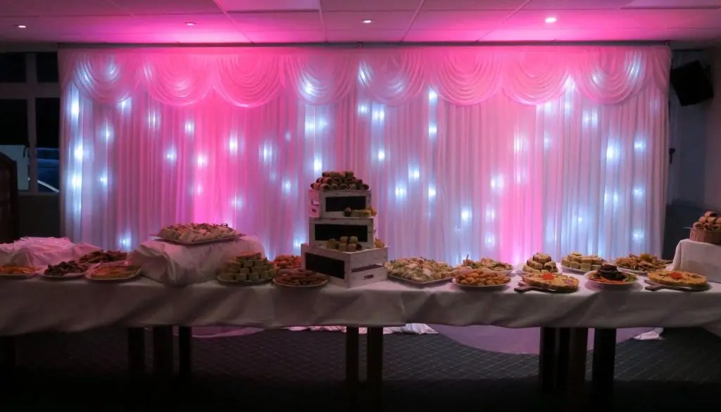 Theydon Bois Golf Club, Essex, White LED Backdrop Behind Buffet Table, Pink Uplighting