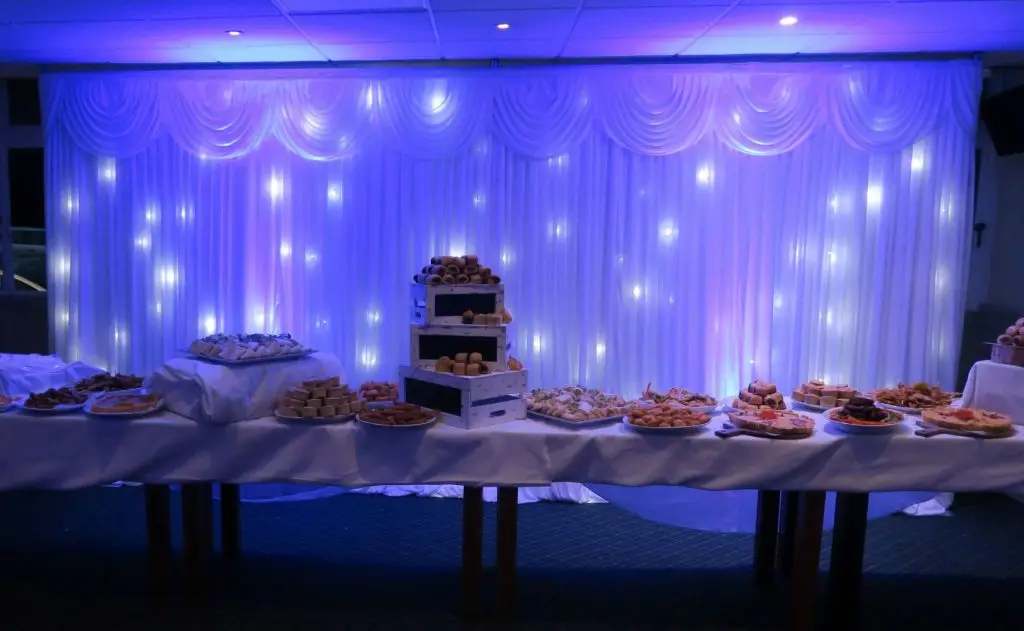 Theydon Bois Golf Club, Essex, White LED Backdrop Behind Buffet Table, Lilac Uplighting